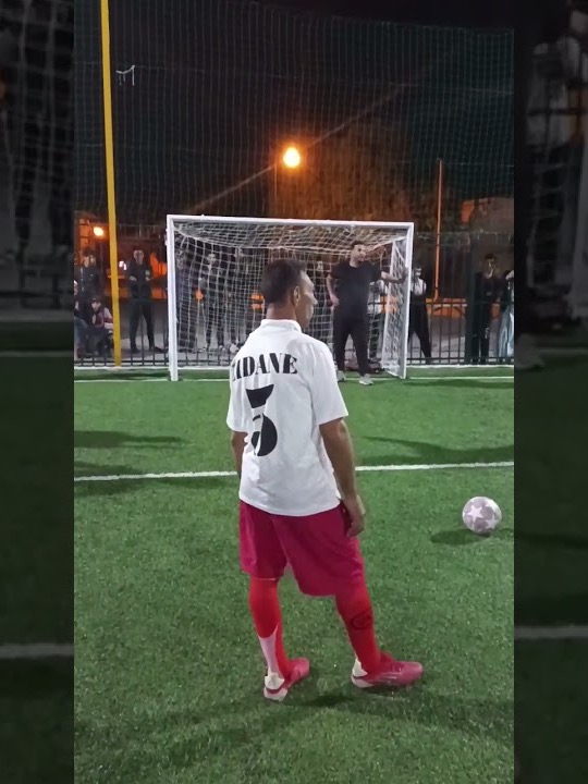 Choucha in a Zidane shirt at night